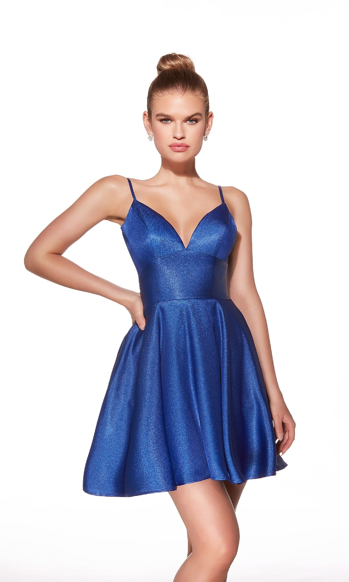 A woman models the Alyce 30062 Strappy-Back Short A-Line Hoco Dress in metallic blue with thin straps, standing against a plain white background.